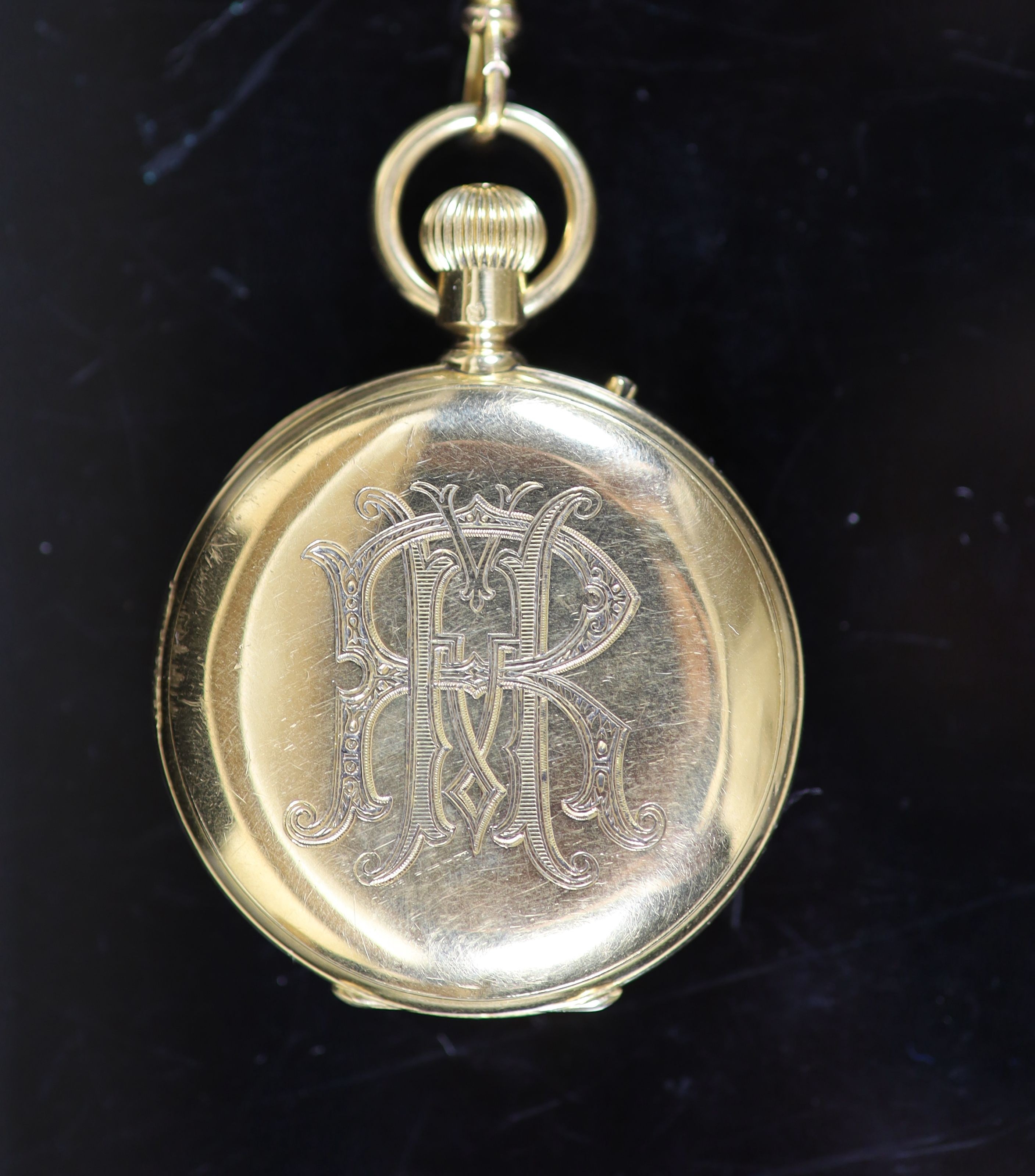 An 18ct gold full hunter keyless lever pocket watch, having white enamel Roman dial with subsidiary seconds dial, engraved monogram, on a 9ct mounted black silk ribbon, with 9ct and amber swivelling fob